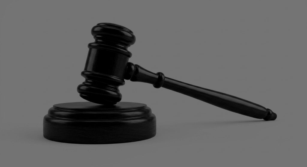 A judge's gavel resting on its sound block, symbolising a clear legal process